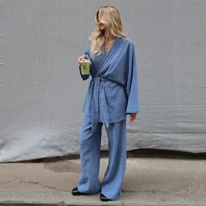Blue cotton crinkle pajama set with long sleeve wrap top and wide leg pants for women