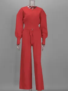 Conjunto vibrante de punto de dos piezas rojo con top con cremallera y pantalón de pata ancha