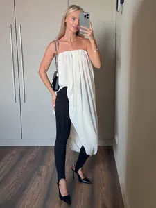 Haut long plissé blanc sans bretelles élégant avec un ourlet tulipe drapé asymétrique