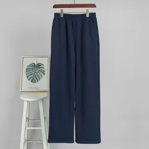 High-waist navy blue wide-leg sweatpants for women, casual autumn style on a hanger.