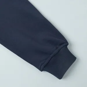 Detailed view of a navy blue sweatshirt ribbed cuff showcasing high-quality fabric texture