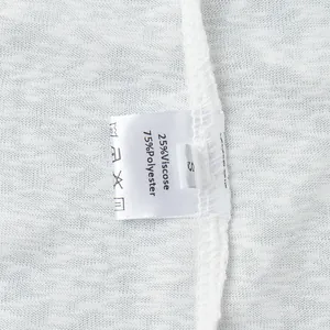 Macro detail shot of a white beachwear care label showing 25% viscose 75% polyester blend