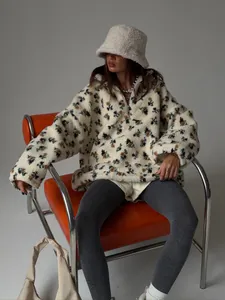 Detailed view of women's floral print sherpa fleece sweatshirt with a matching bucket hat