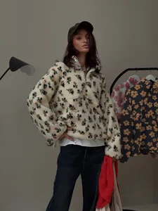 Detailed look at an oversized floral fleece half-zip sweatshirt with autumn vibes
