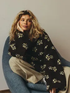 Detail view of cozy brown floral fleece sweatshirt for women in winter style