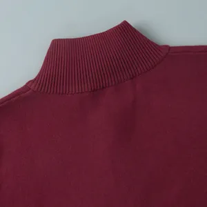 Close-up detail of the ribbed mock neck on a burgundy knit sweater for women.