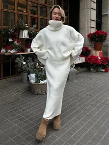 Elegant white turtleneck knit sweater and long skirt set for chic autumn winter style