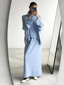 Full view of light blue oversized turtleneck knit sweater and matching maxi skirt set