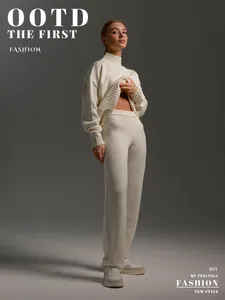 Full-length view of a cream knitted turtleneck sweater and trousers set for women.