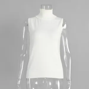 Minimalist sleeveless white turtleneck knitted vest top shown on a clear mannequin