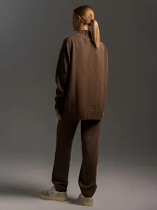 Back view of a cozy brown two-piece knit set featuring half-neck sweater and long pants