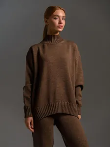 Detailed view of brown knit sweater set featuring a ribbed turtleneck and loose fit style