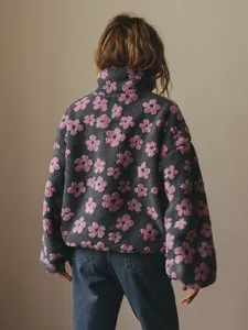 Detailed view of the soft grey fleece jacket with pink floral patterns from the back.