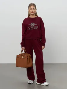 Burgundy casual sweatshirt and wide-leg pants set with embroidery details.