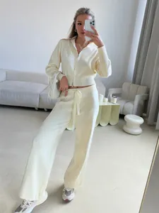 Slim fit cream white two-piece knit set featuring a double zip hoodie and wide leg pants