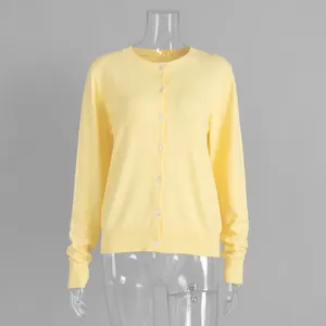 Elegant pastel yellow button-up crew neck knitted cardigan sweater detail for women