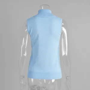 Detailed back view of a light blue knitted high neck sleeveless vest for women on mannequin