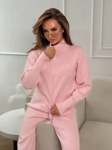 Close-up detail showing the fine texture of a pink two-piece knitted zipper set