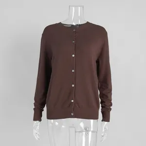 Front view detail of a dark brown button-up knit cardigan on a clear mannequin