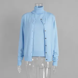 Detailed macro view of women's light blue knitwear set with sleeveless top and cardigan