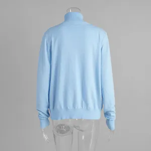 Detailed back view of a soft light blue turtleneck knit sweater for women, fall style