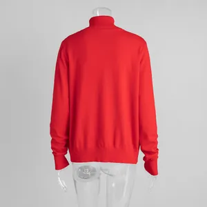 Back view detail of a vibrant red high-neck knit sweater featuring ribbed cuffs and hem.