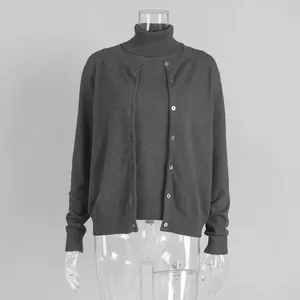 Detailed view of women's dark gray turtleneck top and cardigan knitwear set
