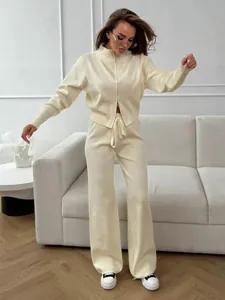 Elegant women's cream zip-up knit set featuring wide-leg pants for autumn fashion