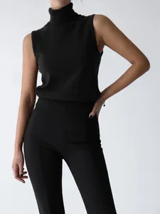 Detailed view of women's black high-neck knitted sleeveless vest with slim fit design