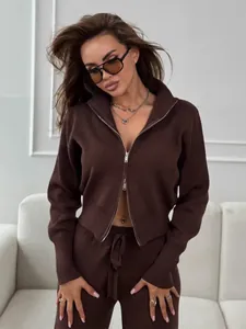 Elegant brown two-piece knit set featuring double zip-up sweater and matching slim fit pants