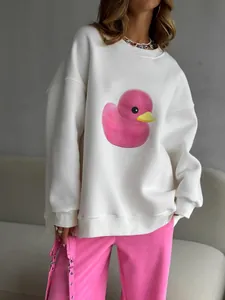 Felpa bianca oversize con grande stampa di una papera di gomma rosa sul davanti
