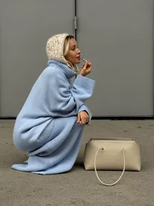 Stylish oversized light blue turtleneck sweater and matching knit maxi skirt two-piece set