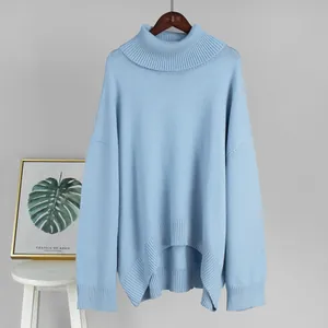 Soft light blue oversized turtleneck knitted sweater featuring high-low ribbed hemline