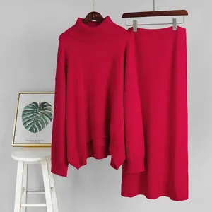 Vibrant fuchsia women's high-neck knit sweater and matching midi skirt two-piece set