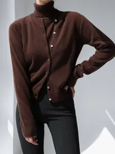 Detailed view of women's dark brown turtleneck top and cardigan knitwear two-piece set