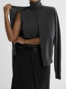 Grey two-piece knit set featuring high-neck sleeveless top and buttoned cardigan