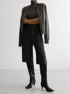 Detailed look of gray turtleneck knit top and cardigan set for women.