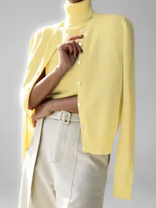 Pale yellow knitwear set including a sleeveless turtleneck and a matching knit cardigan