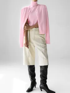 Pink knit sweater set featuring a high-neck sleeveless top and matching cardigan