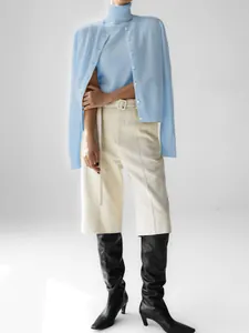 Full look at a blue knit turtleneck top and matching cardigan sweater set for women.