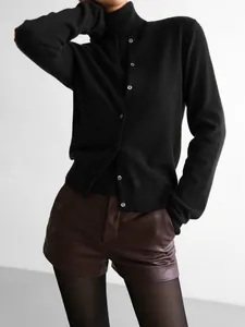 Elegant black two-piece knitwear set with sleeveless turtleneck and button cardigan