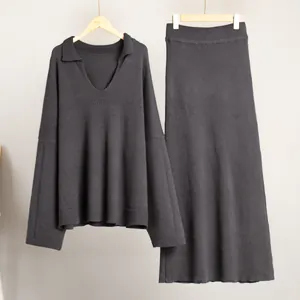 Fashionable charcoal gray V-neck knit sweater and matching ribbed midi skirt set
