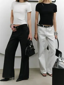 Detail view of minimalist slim fit short sleeve crop tops in black and white styling