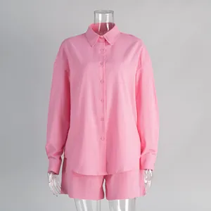 Women's pink pure cotton long-sleeve shirt and matching shorts set on clear mannequin.
