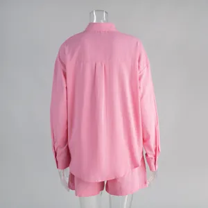 Detailed rear view of a pink cotton long-sleeve shirt and matching shorts set for women