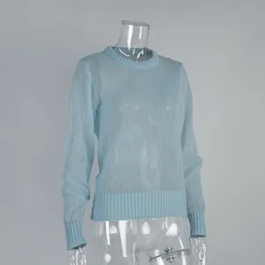 Macro view of light blue semi-sheer mohair knit texture on crew neck pullover