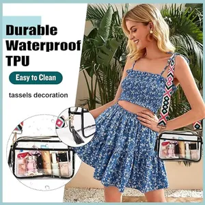Detail of transparent TPU crossbody bag with geometric strap and tassel decoration