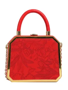 Red octagonal evening box bag with floral embossing, top handle and gold chain strap