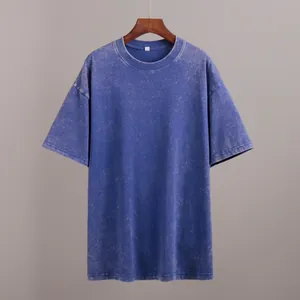 Close-up detail showing the vintage acid wash texture and round neckline of the blue T-shirt