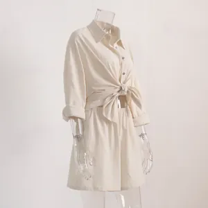 Detail view of women's cream linen-blend long sleeve tie-front shirt and shorts set